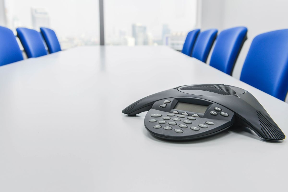 Conference phone on a meeting room table